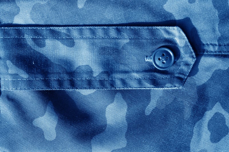 Part of military camo uniform in navy blue tone.